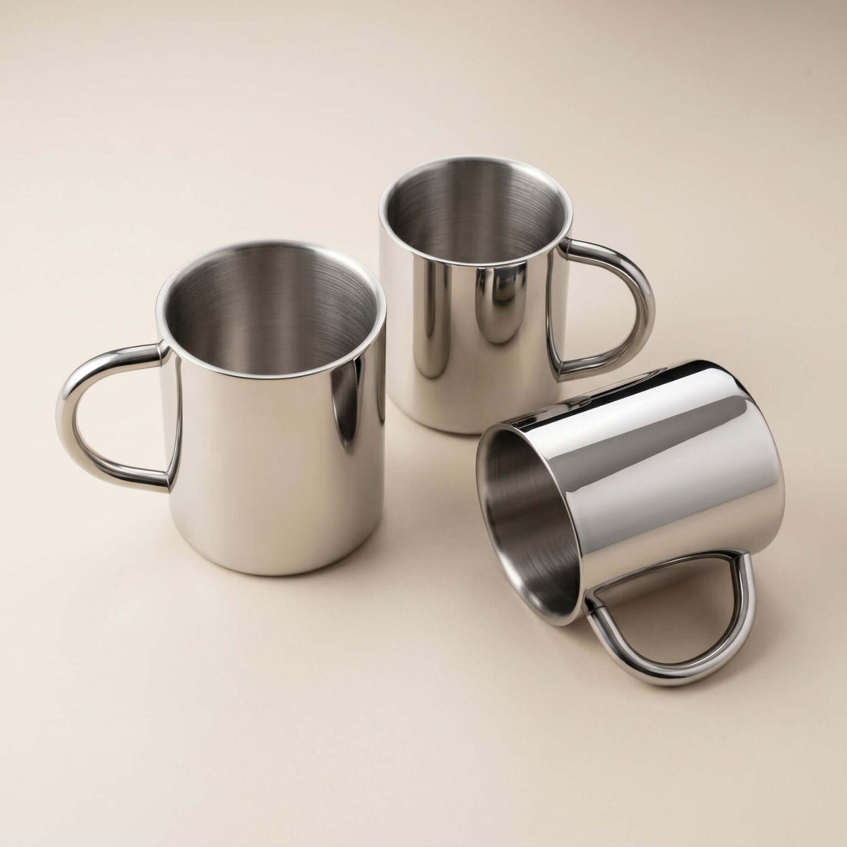 Glossy silver double-layer stainless steel cup with curved handle