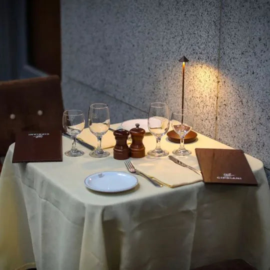 Wireless LED table lamp with a slim stem, conical shade and round base