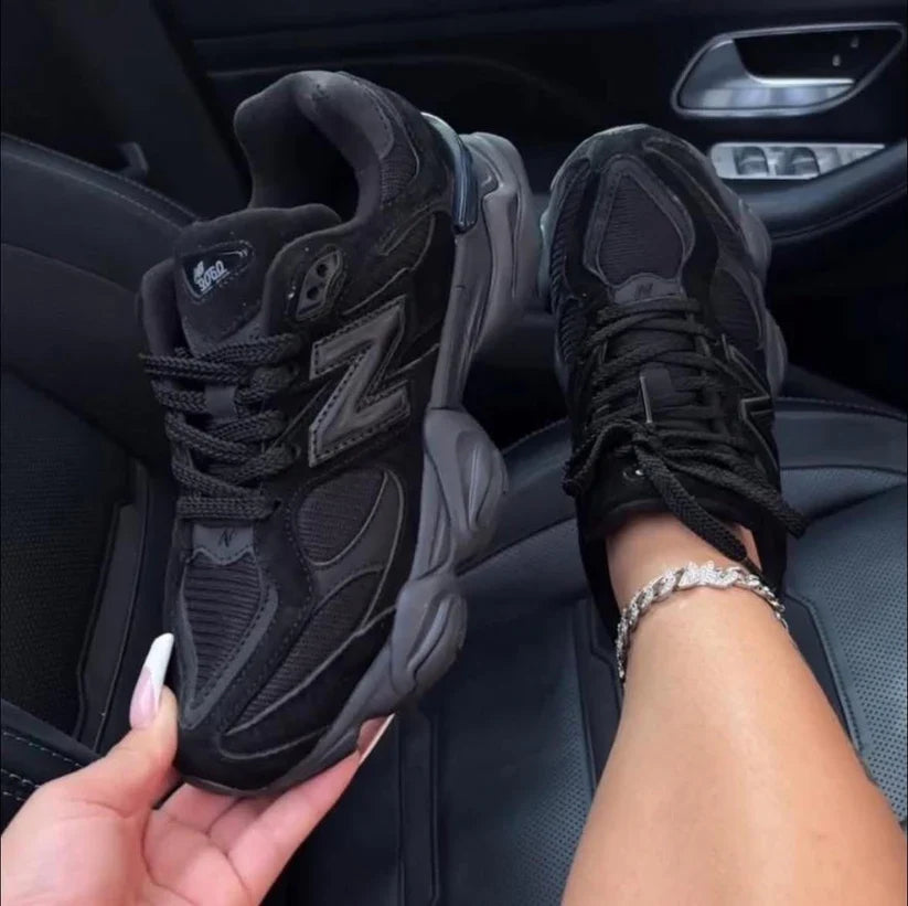 Black low top lace-up trainers with mesh panels and chunky layered soles