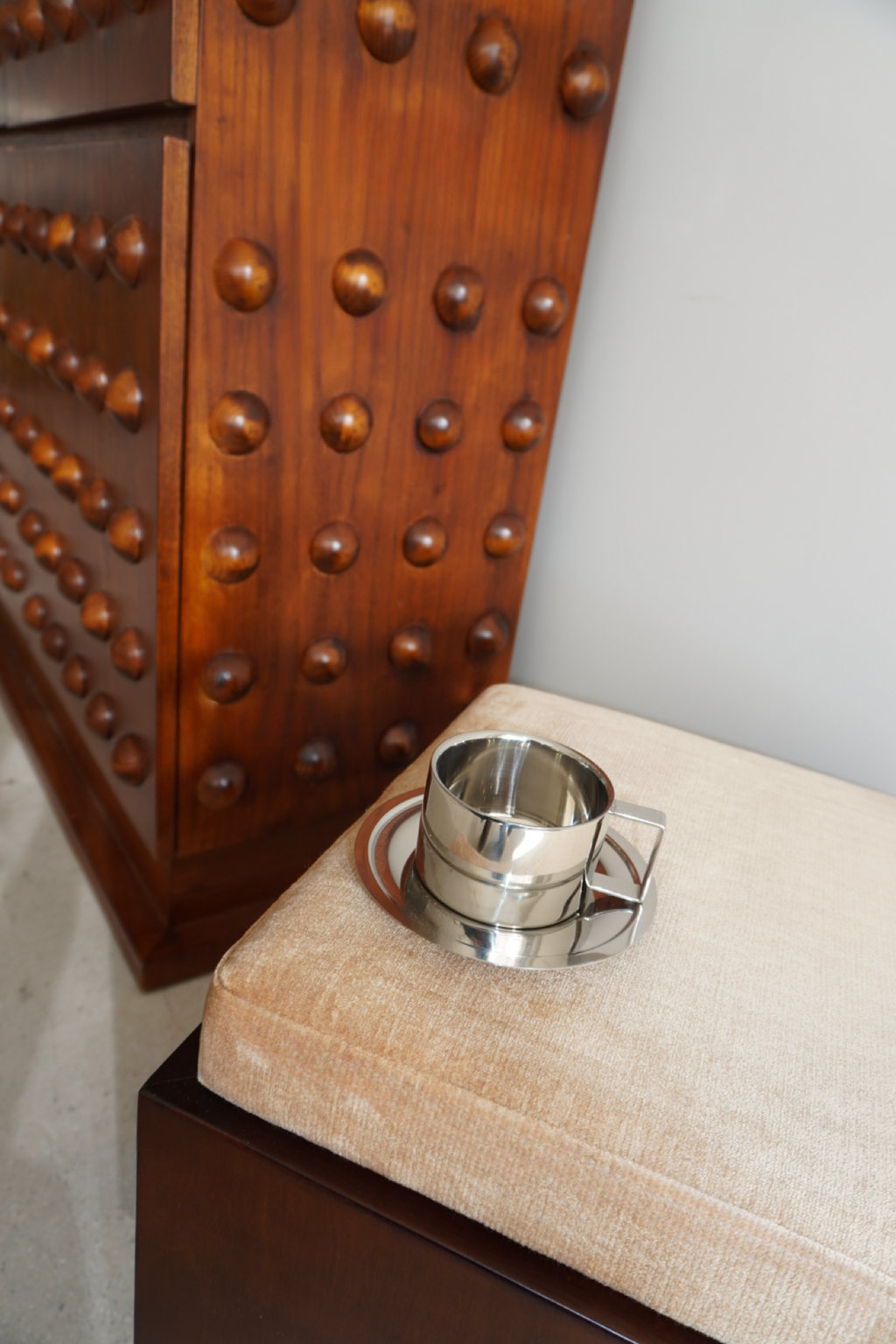Silver handled coffee mug with matching round saucer
