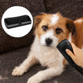 Black handheld dog grooming brush with fine comb edge