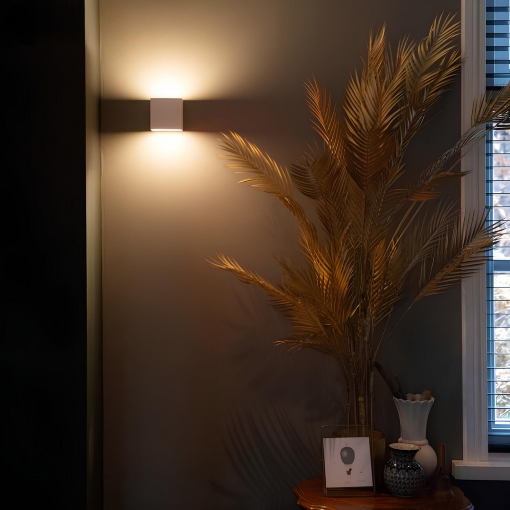 Geometric LED wall light projecting light upwards and downwards