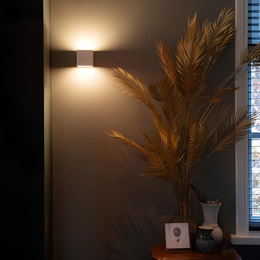 Geometric LED wall light projecting light upwards and downwards
