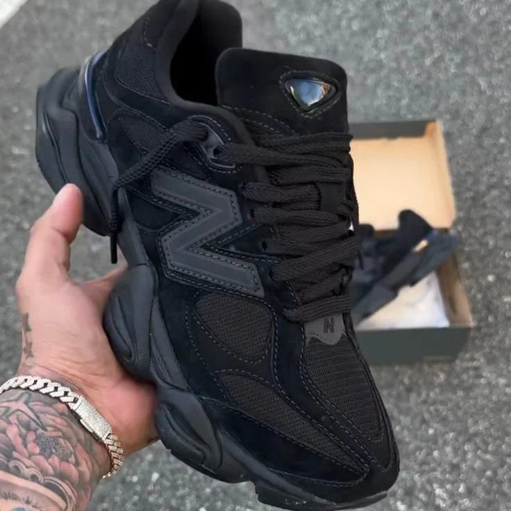 Black low top lace-up trainers with mesh panels and chunky layered soles