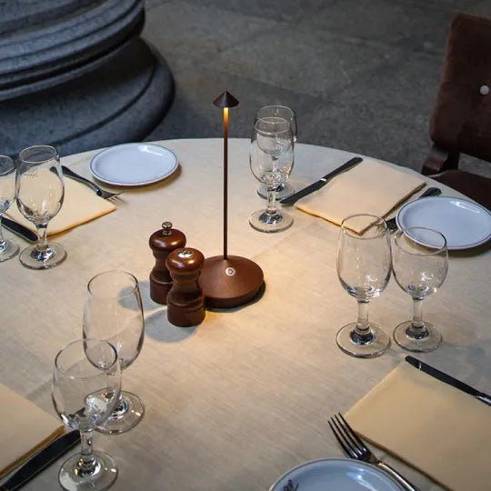 Wireless LED table lamp with a slim stem, conical shade and round base