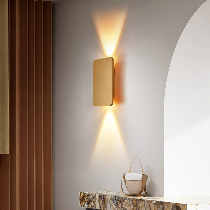 Rectangular indoor wall lamp casting warm upward and downward light