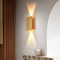Rectangular indoor wall lamp casting warm upward and downward light