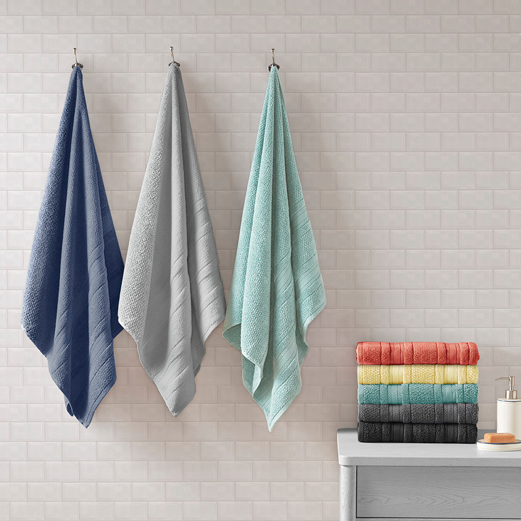 Six-piece textured bath towel set with decorative border detailing