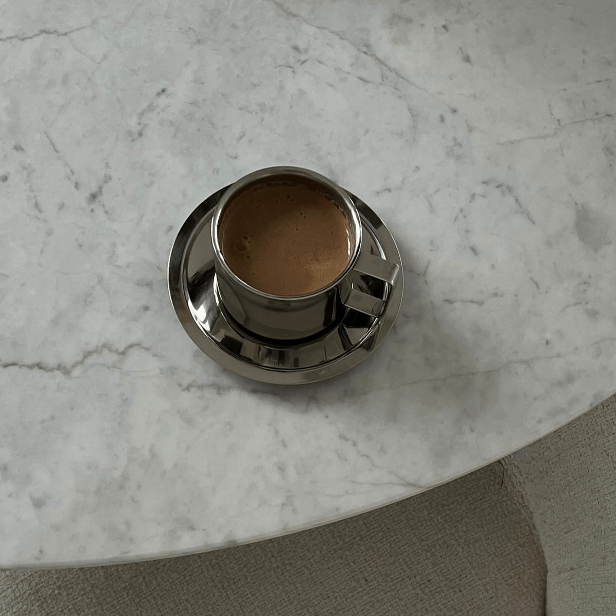 Silver steel latte coffee cup with matching saucer and spoon