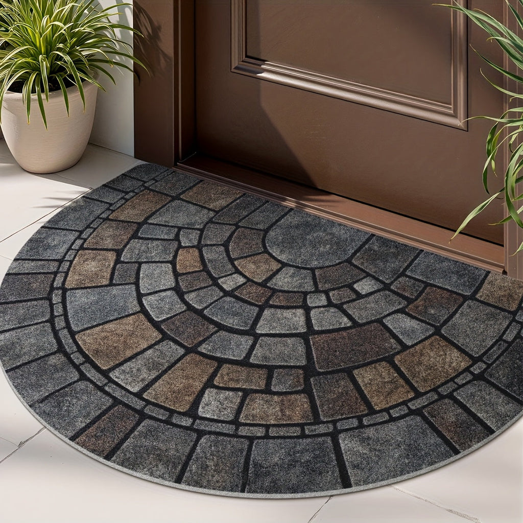 Grey half-circle door mat with geometric mosaic pattern