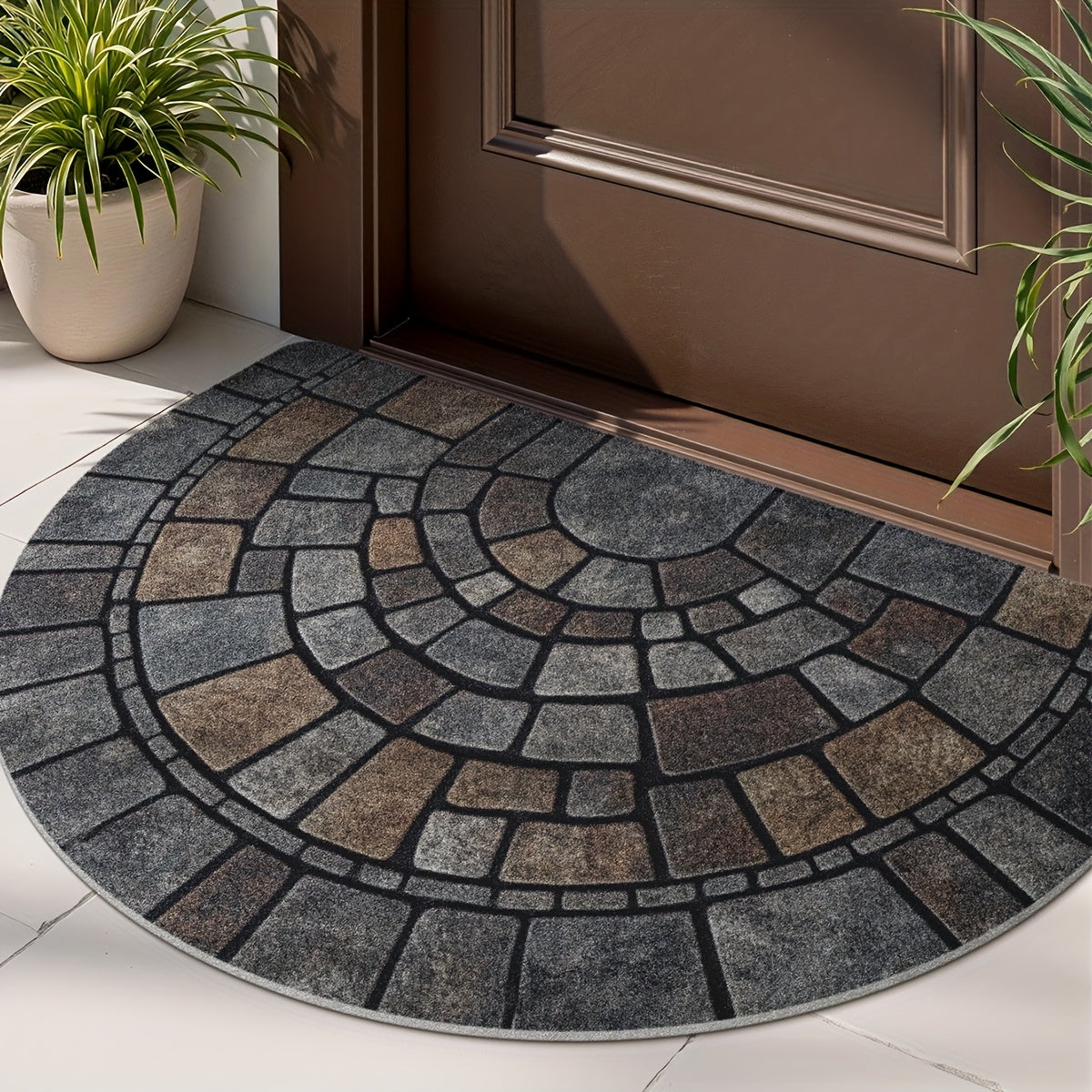 Grey half-circle door mat with geometric mosaic pattern