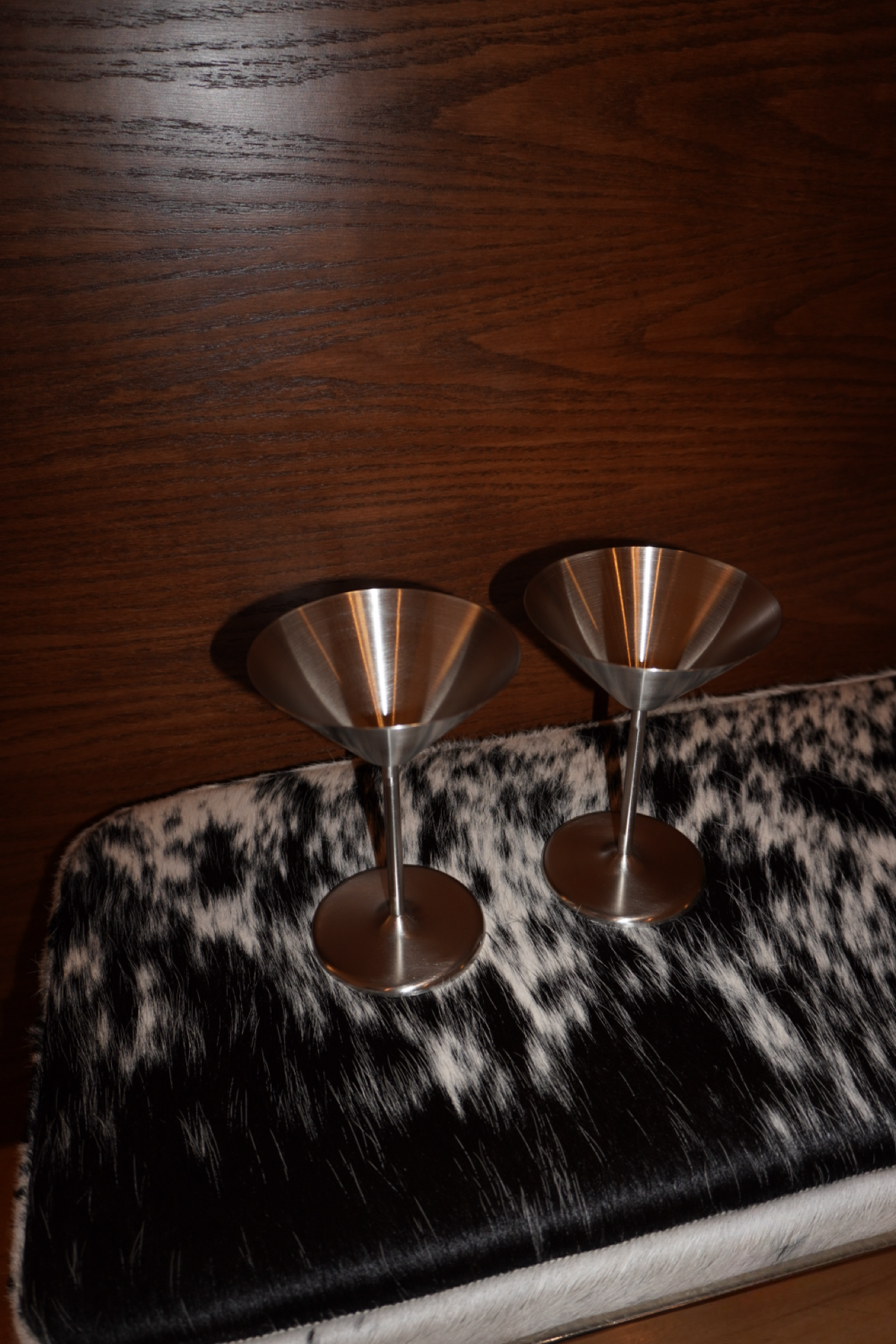 Pair of silver metallic stemmed martini glasses