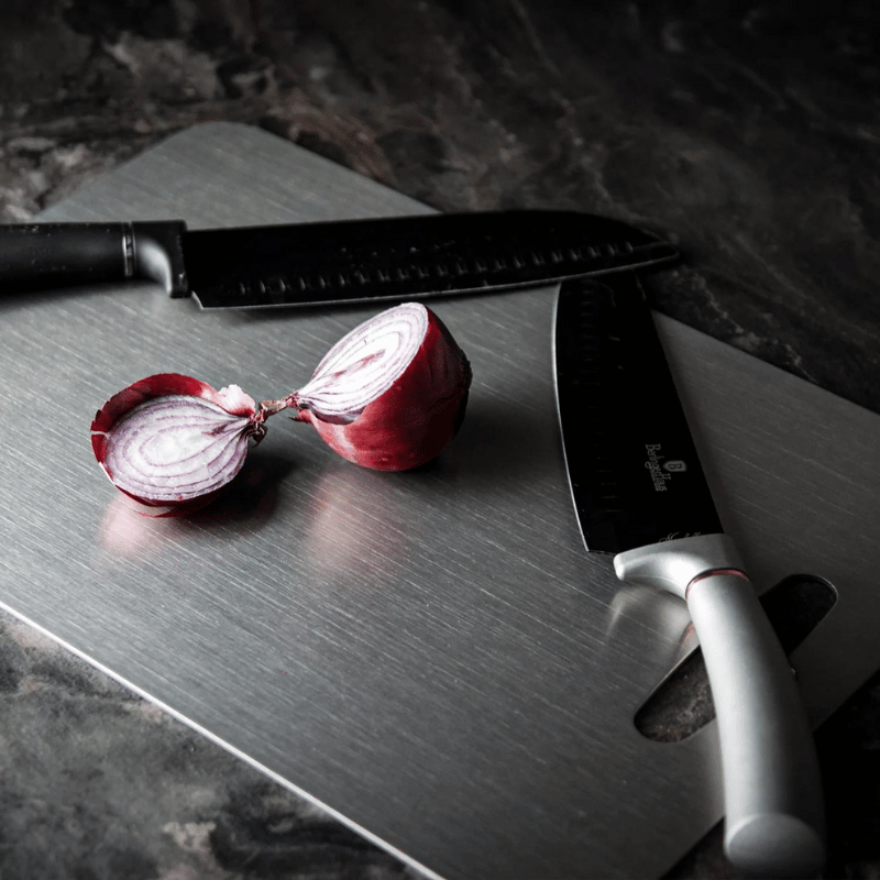 Three grey rectangular chopping boards with rounded corners and hanging holes