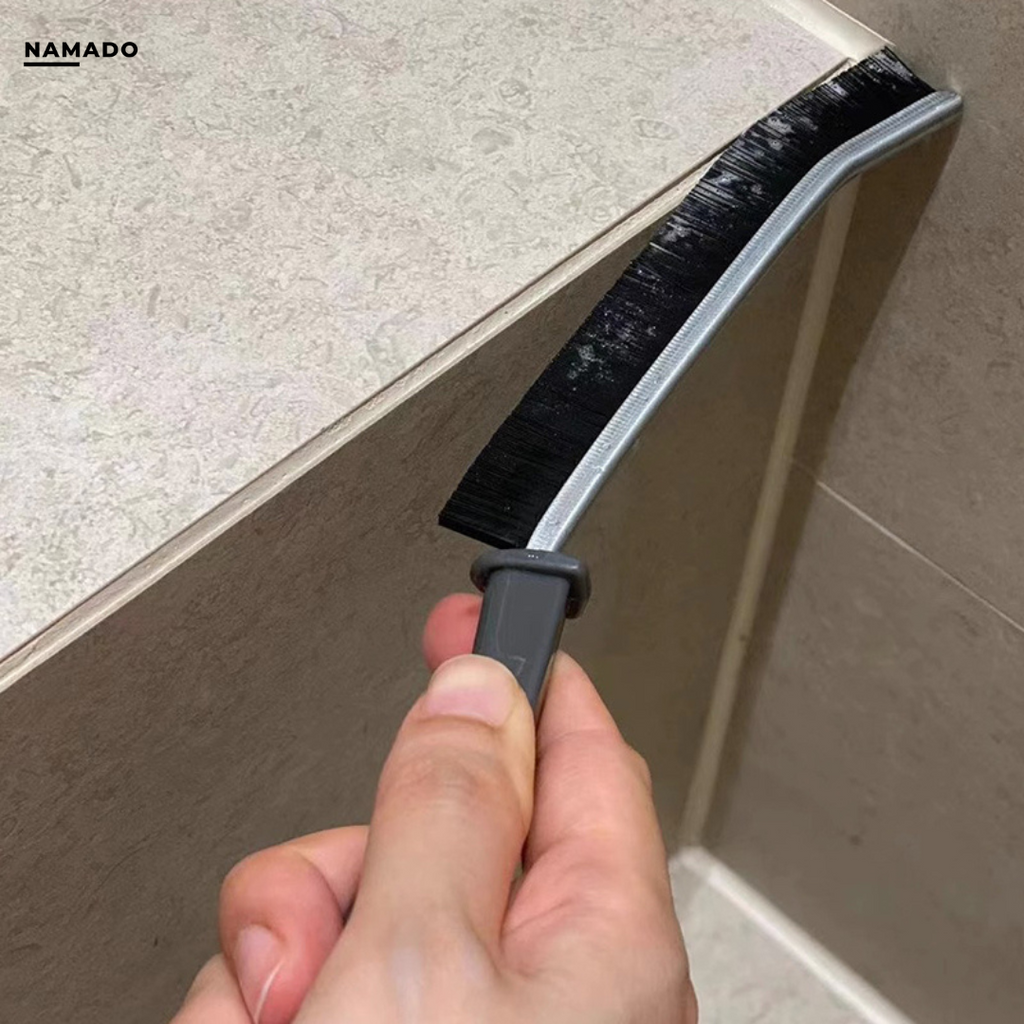 Black long-handled cleaning brush with narrow bristle head