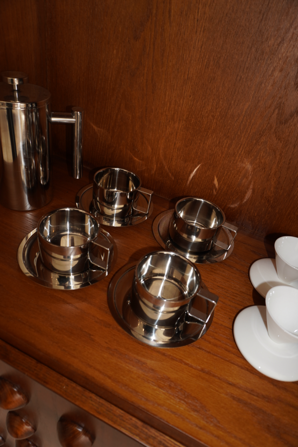 Silver handled coffee mug with matching round saucer
