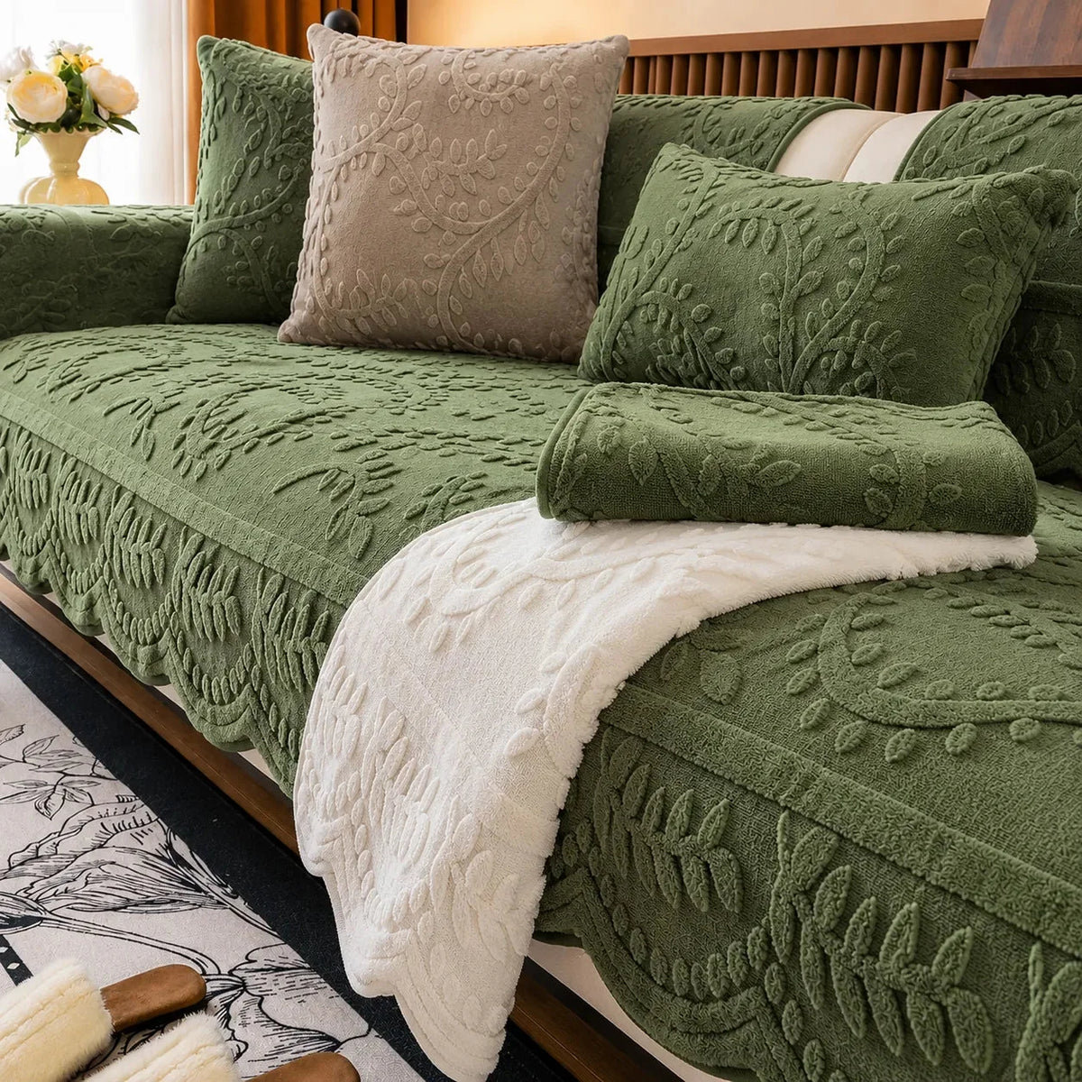 Plush sofa cover with raised botanical leaf texture and scalloped edge