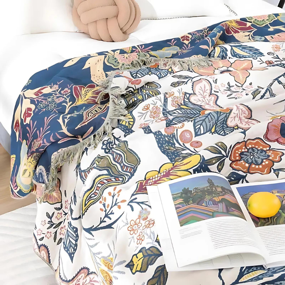 White floral blanket with colourful botanical print and fringed edge