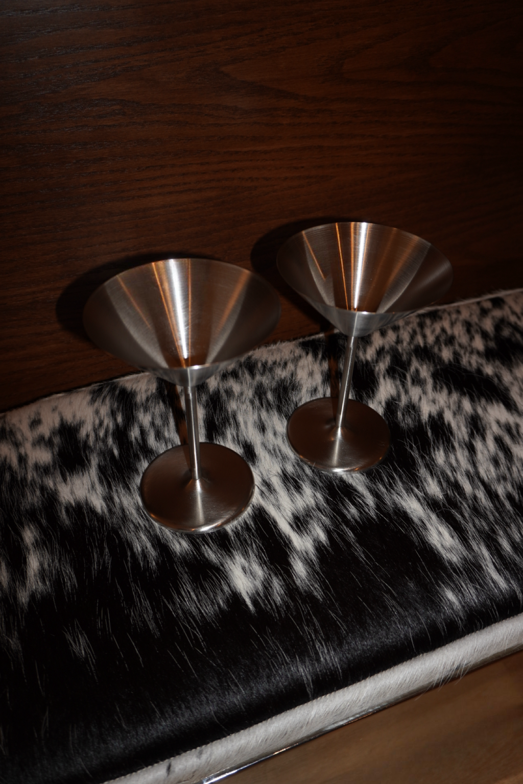 Pair of silver metallic stemmed martini glasses