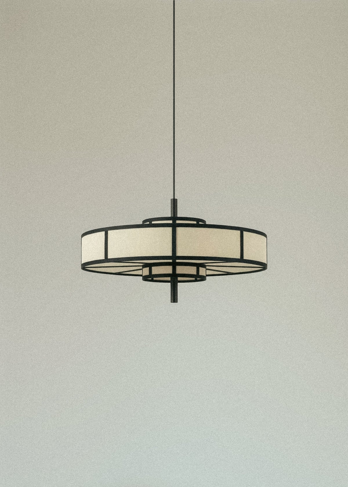 Black frame pendant light with cream drum shade