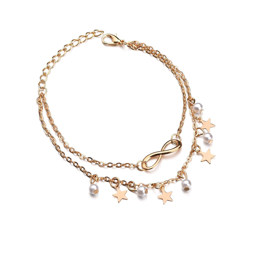 Layered anklet bracelet with pearl and star charms