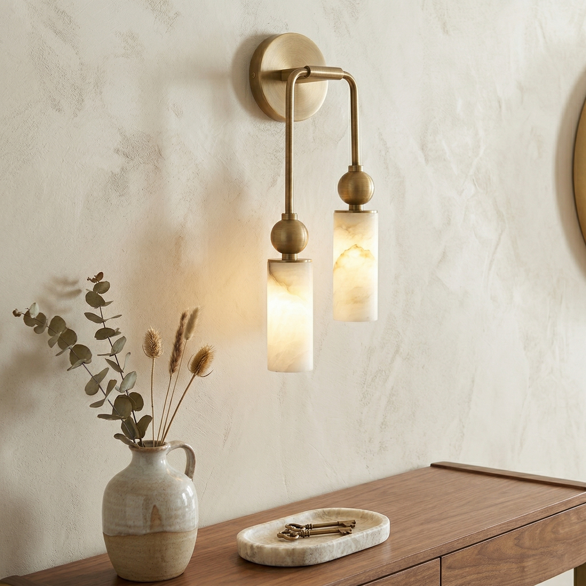 Double brass-tone wall lamp with two alabaster cylindrical shades