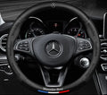 Steering wheel cover with carbon effect textured panels and accent stripe