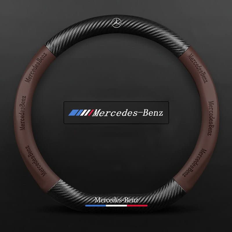 Steering wheel cover with carbon effect textured panels and accent stripe