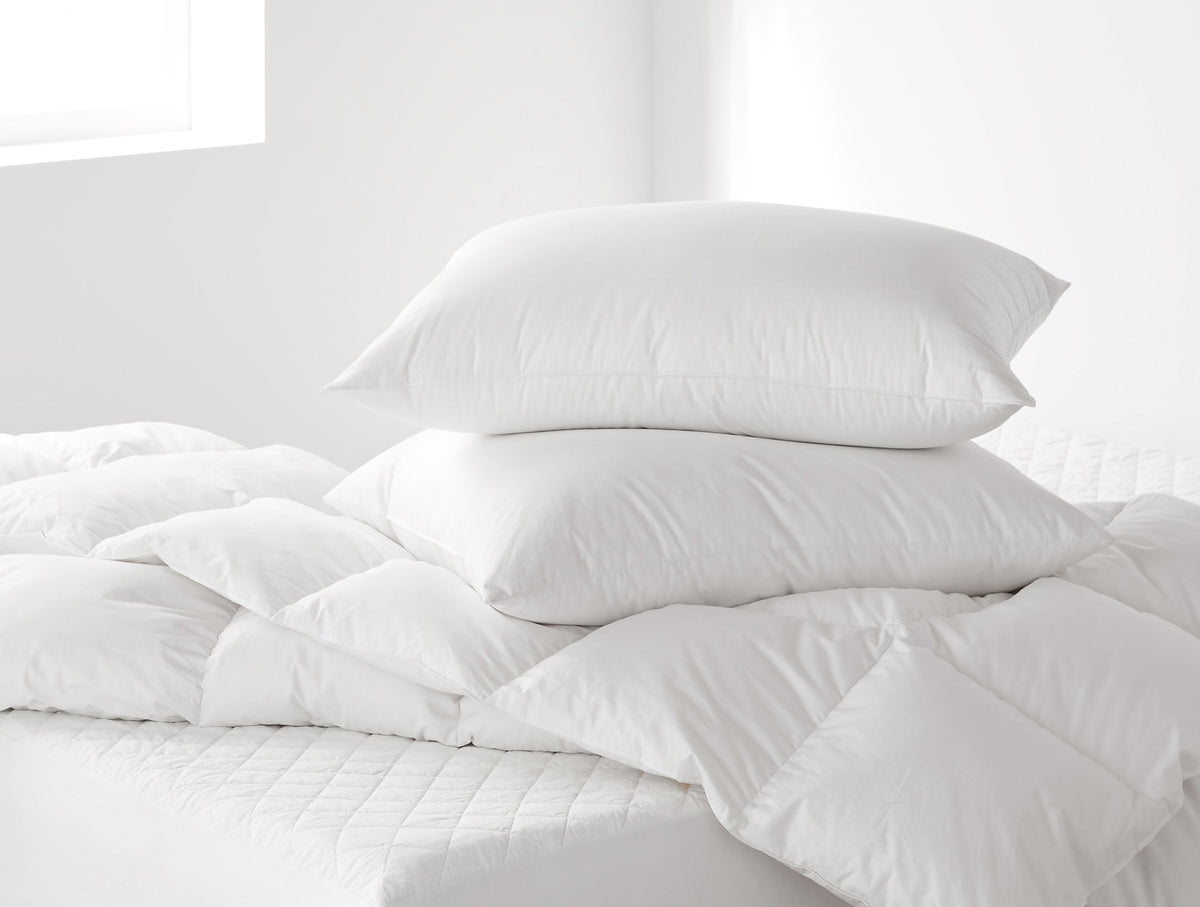 White down feather pillow insert with a soft quilted cover