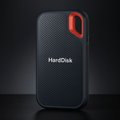 Black portable external SSD hard drive with textured case, red carry loop and USB cable