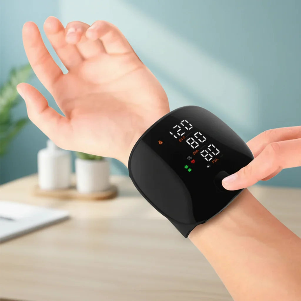 Black wrist blood pressure monitor with digital SYS DIA PUL display