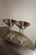 Pair of silver metallic stemmed martini glasses