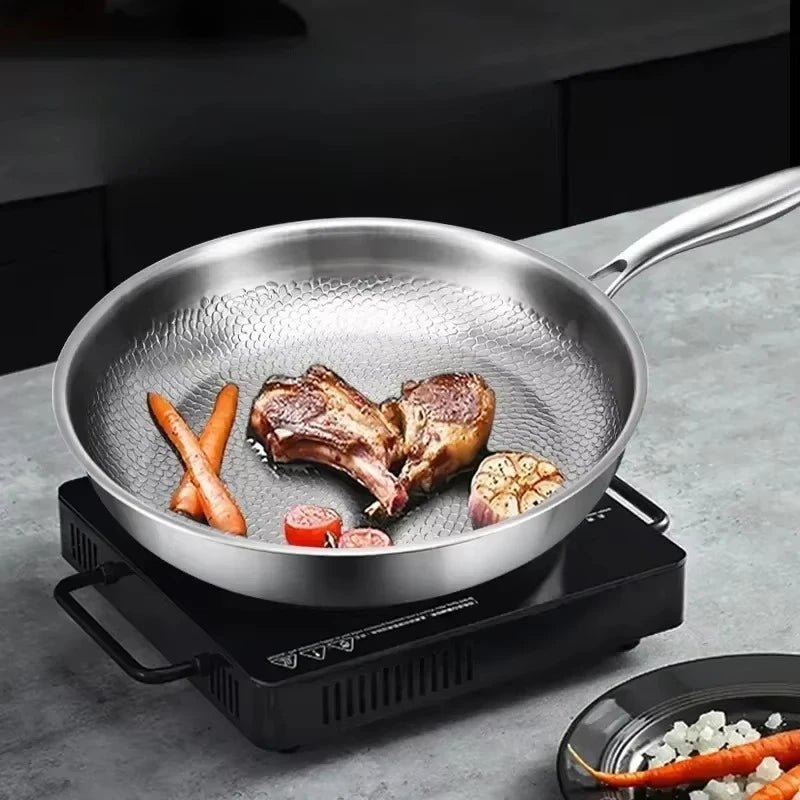 Silver titanium non-stick frying pan with hammered interior and long handle