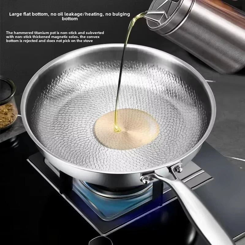 Silver titanium non-stick frying pan with hammered interior and long handle