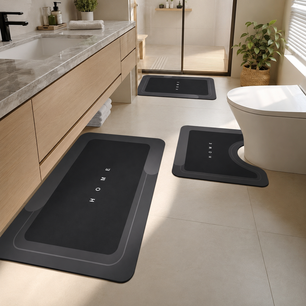 Three-piece black bathroom mat set with toilet, sink and bath mats