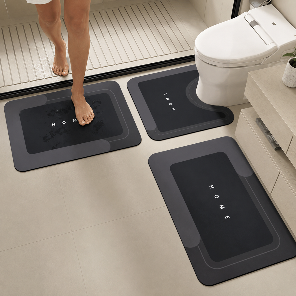 Three-piece black bathroom mat set with toilet, sink and bath mats