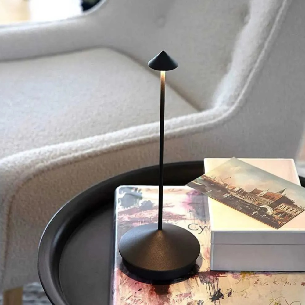Minimal table lamp with slim stem, conical shade and round base