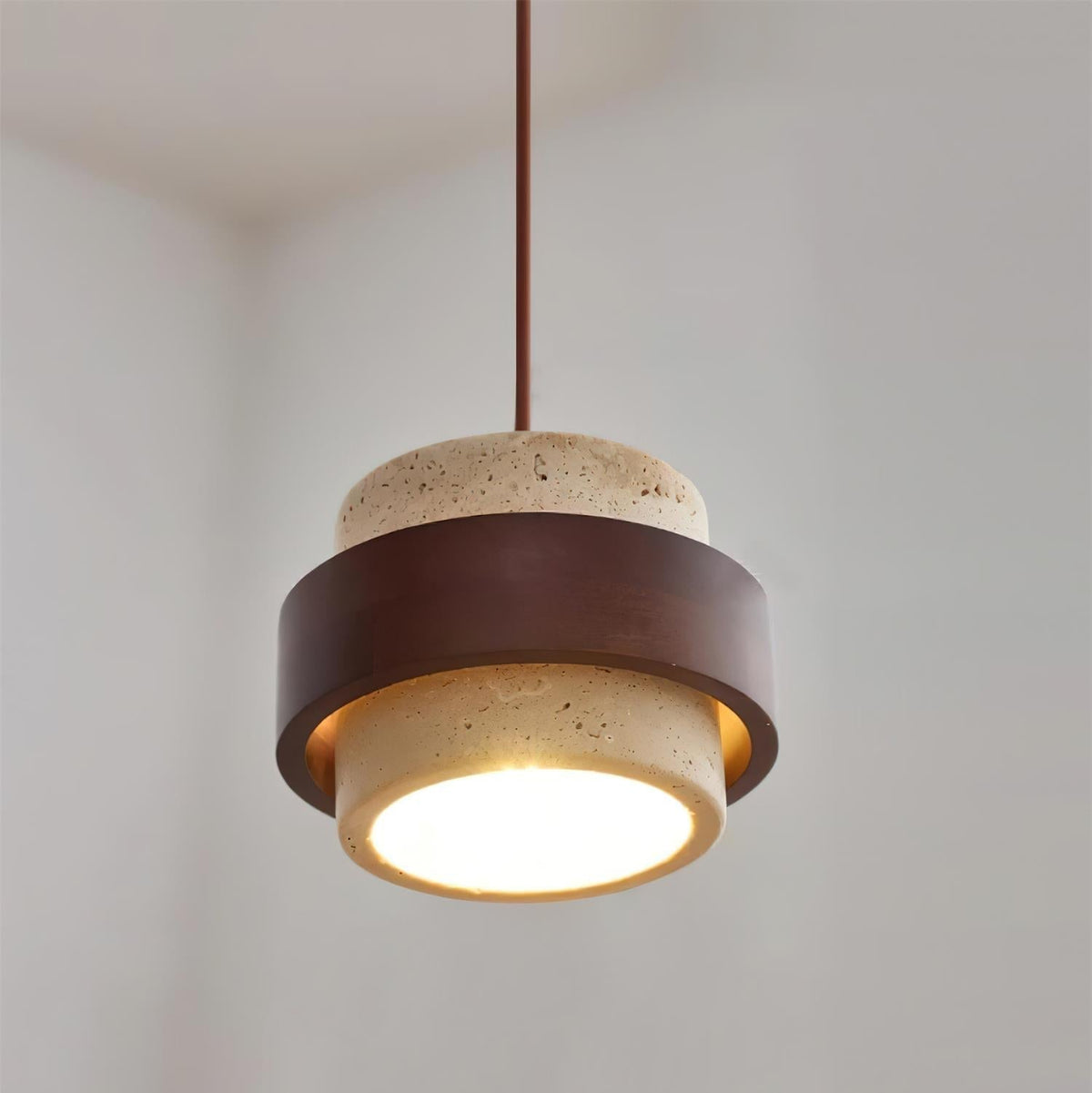 Pendant light with cream textured cylindrical shade and dark brown band