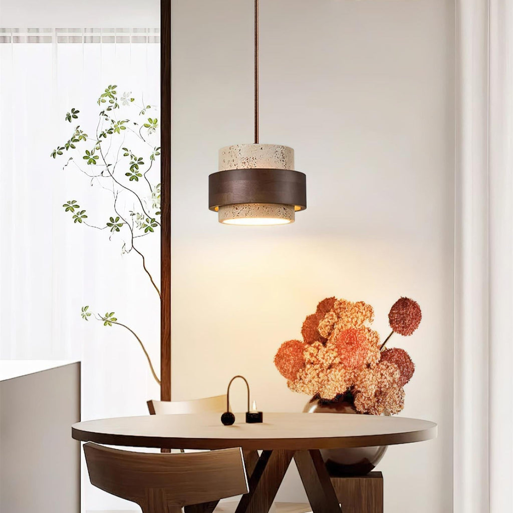 Pendant light with cream textured cylindrical shade and dark brown band