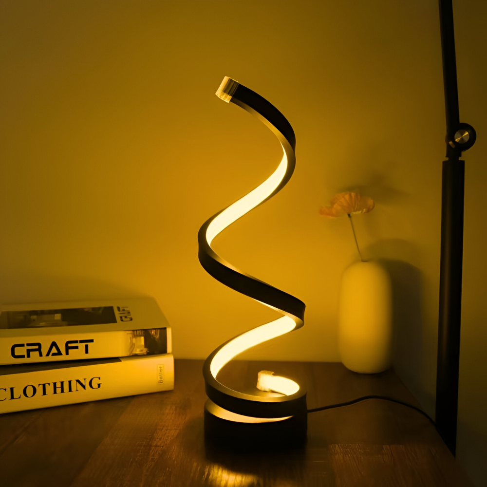 Spiral table lamp with illuminated light strip and round base