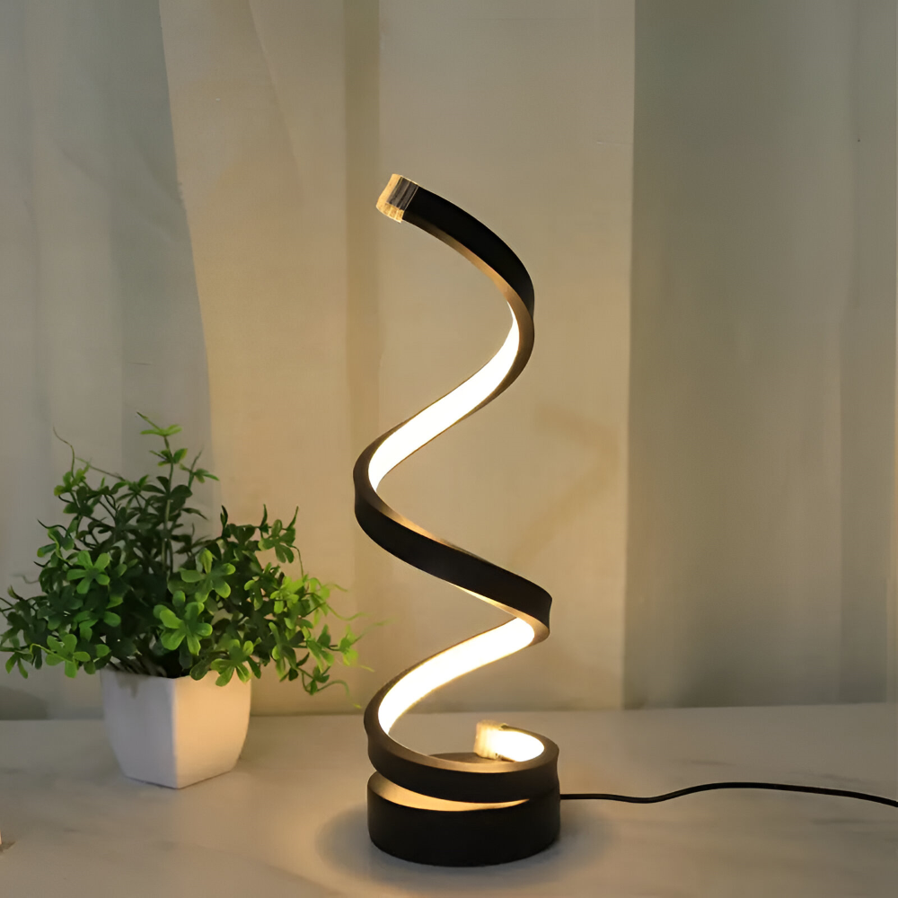 Spiral table lamp with illuminated light strip and round base