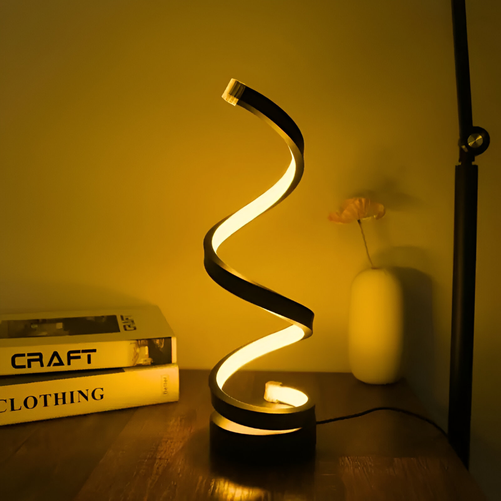 Spiral table lamp with illuminated light strip and round base