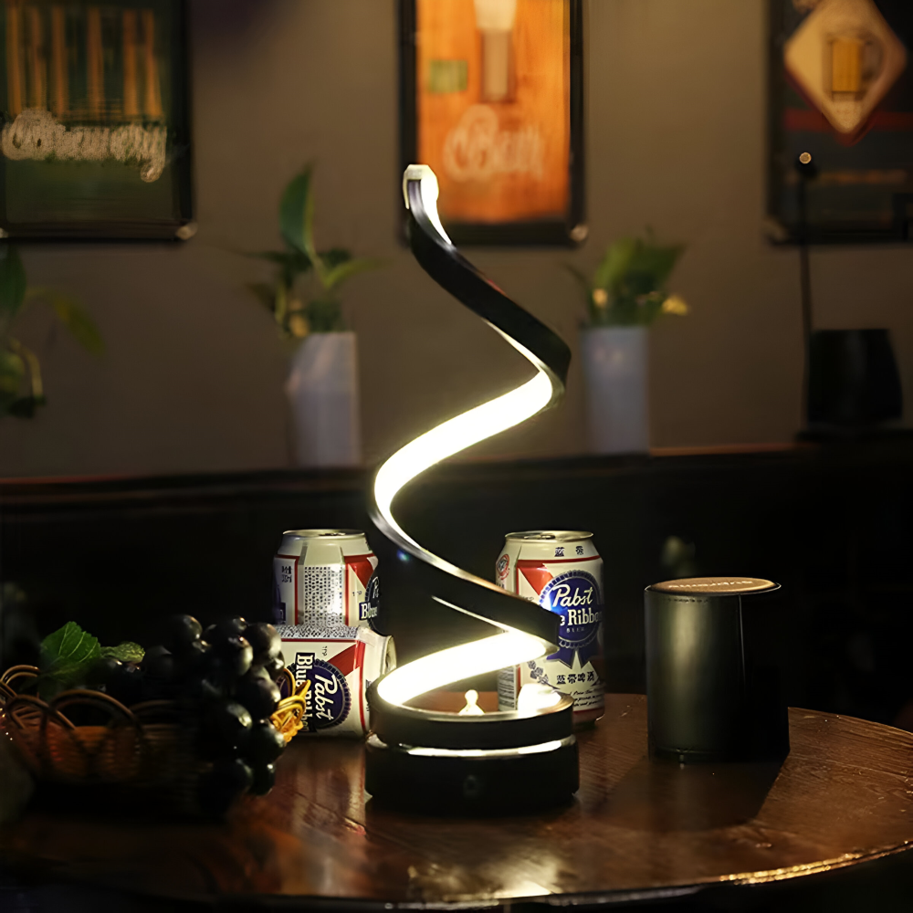 Spiral table lamp with illuminated light strip and round base