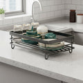 Double-layer foldable dish drying rack beside a kitchen sink
