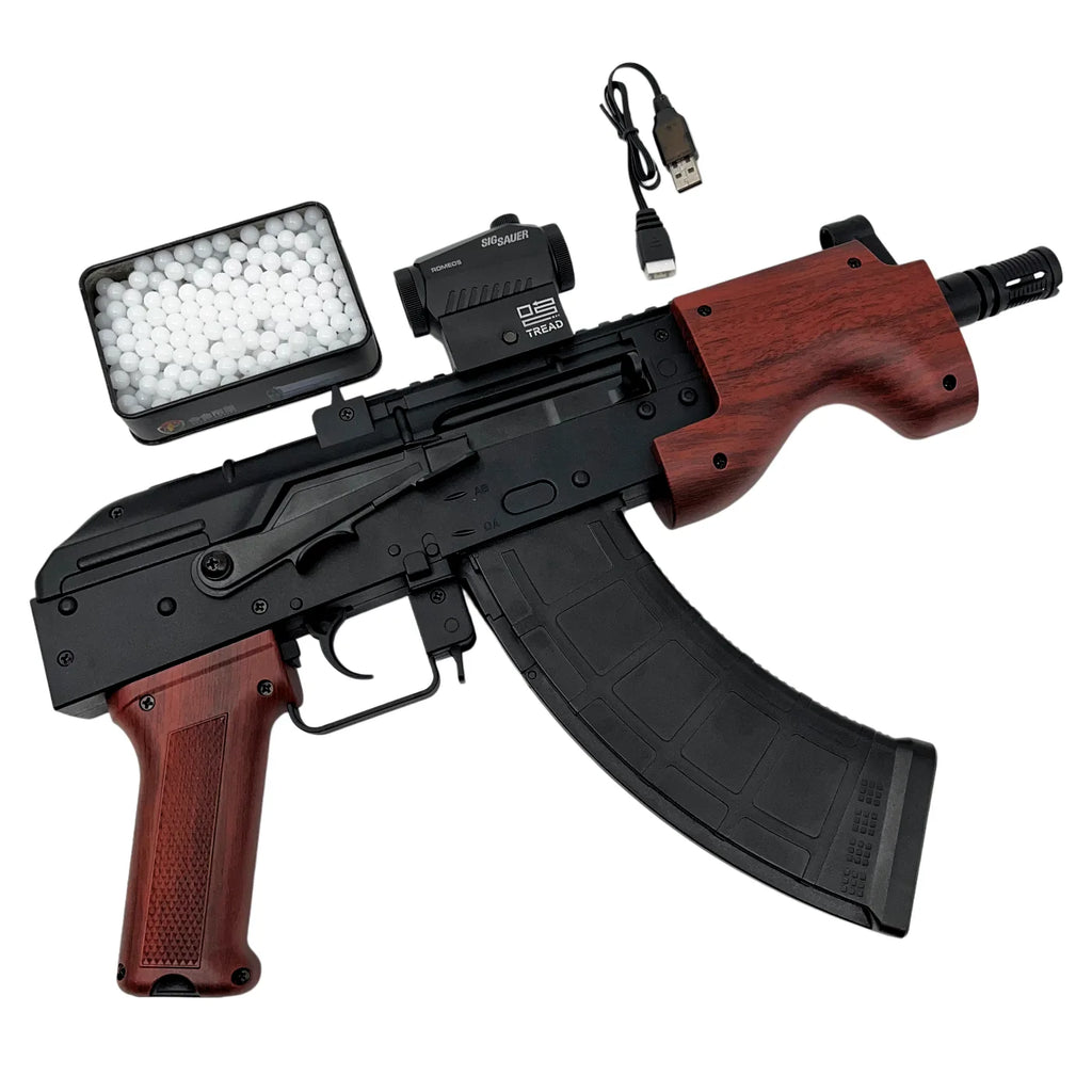 Gold AK47-style gel blaster with goggles and white gel beads
