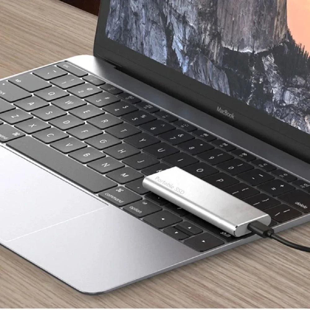 Portable 4TB SSD with USB-C port, cable and connection adapters