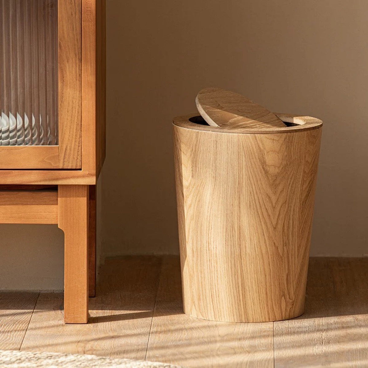 Brown cylindrical wood-effect waste bin with rotating lid