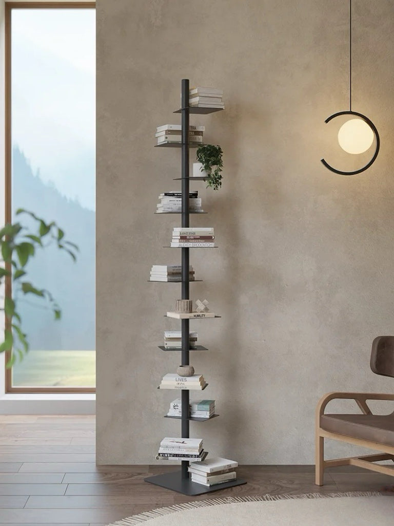 Freestanding steel bookshelf with staggered ledge shelves
