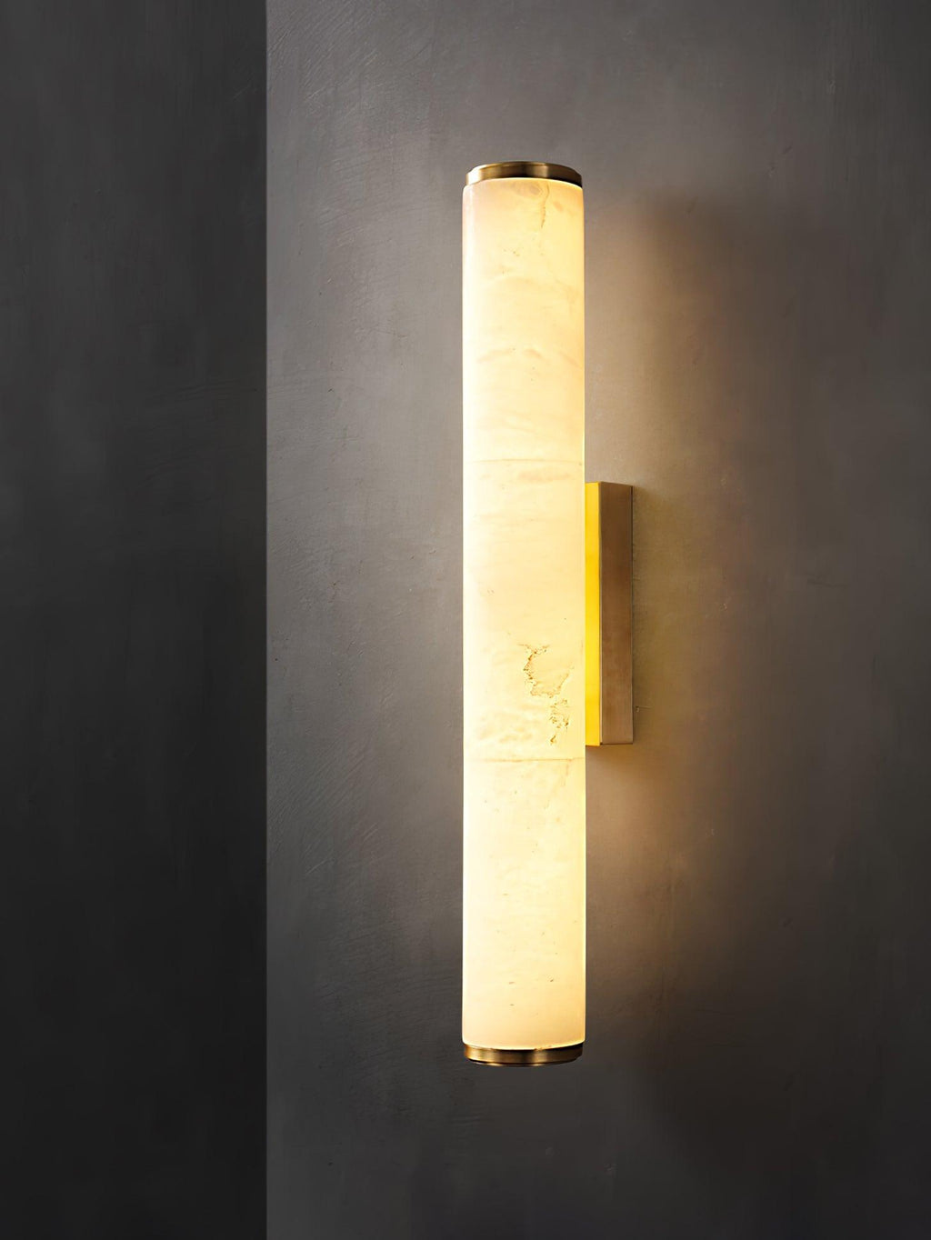 Vertical alabaster column wall sconce with cylindrical illuminated shade