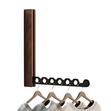 Collapsible wall-mounted hanger rail with wood-effect folding panel and metal hanging bar