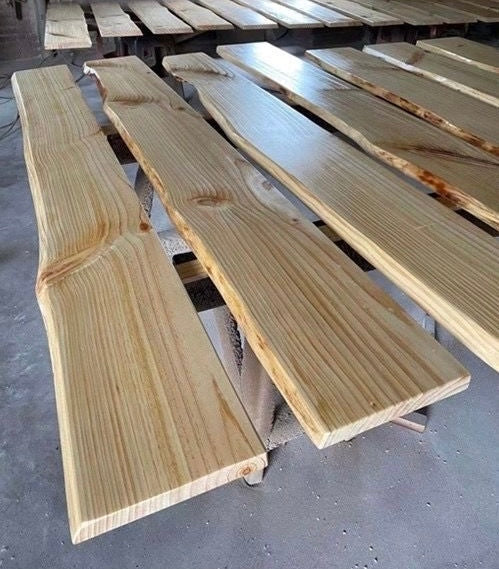 Brown rustic hardwood wall shelf with an irregular live edge